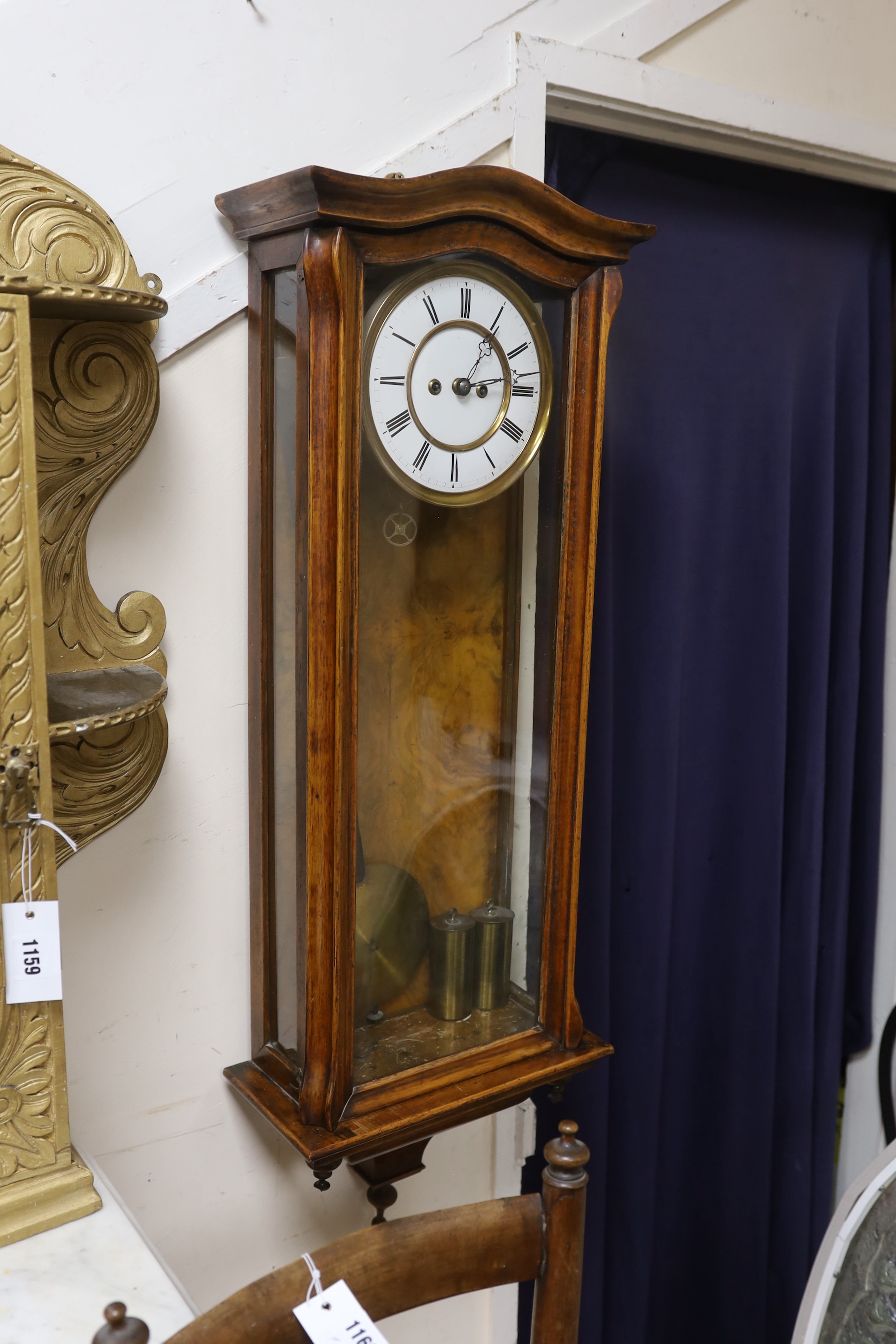 A 19th century Viennese regulator with key and weights, striking on a coiled gong, 103cm high
